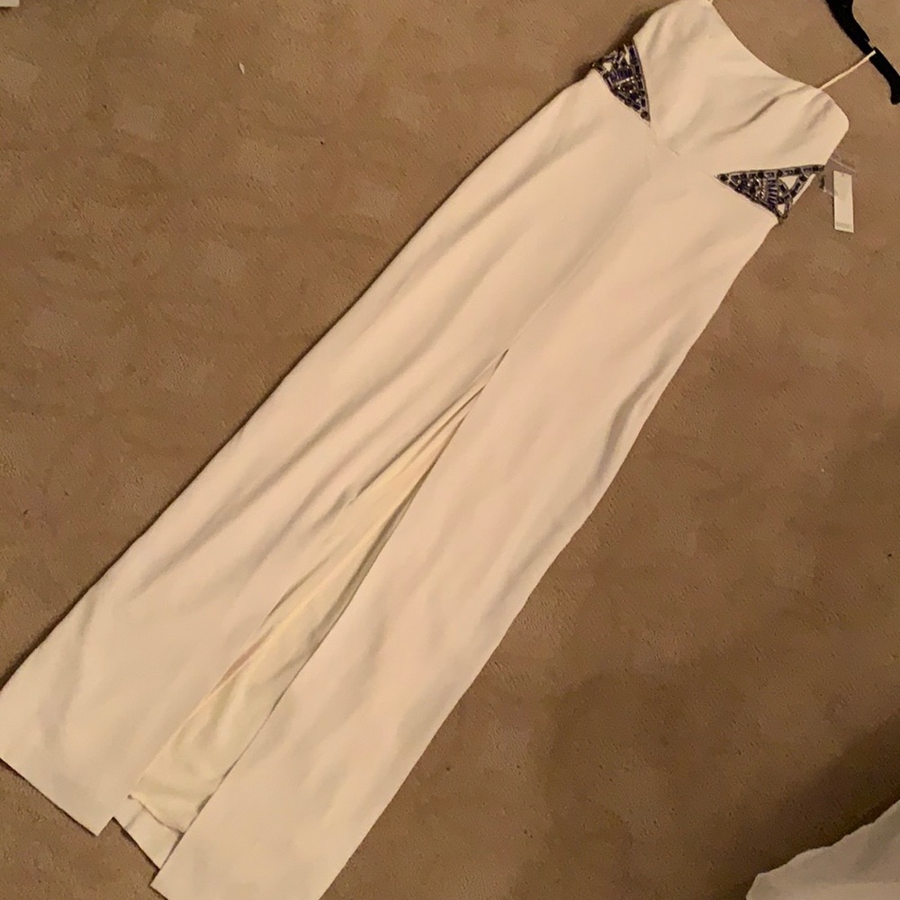 Long cream strapless evening gown.